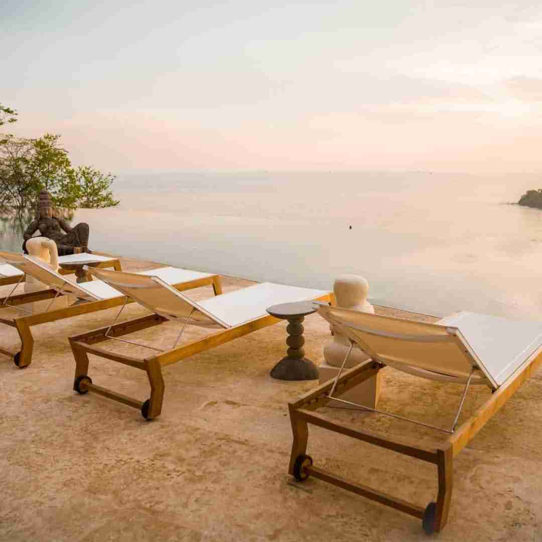 Tranquil terrace scene at Casa Chamaleon in Las Catalinas, Costa Rica. Loungers invite relaxation against the backdrop of the vast ocean, creating a perfect blend of luxury and coastal serenity at this idyllic Costa Rican destination.