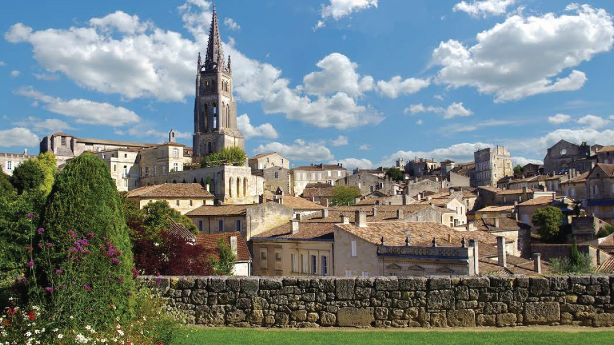 Saint-Emilion in Bordeaux, France, captivating self-flying pilots with their own aircraft, showcasing its historic castle and charming villa amidst lush gardens, offering a glimpse into Europe's timeless elegance and cultural richness.