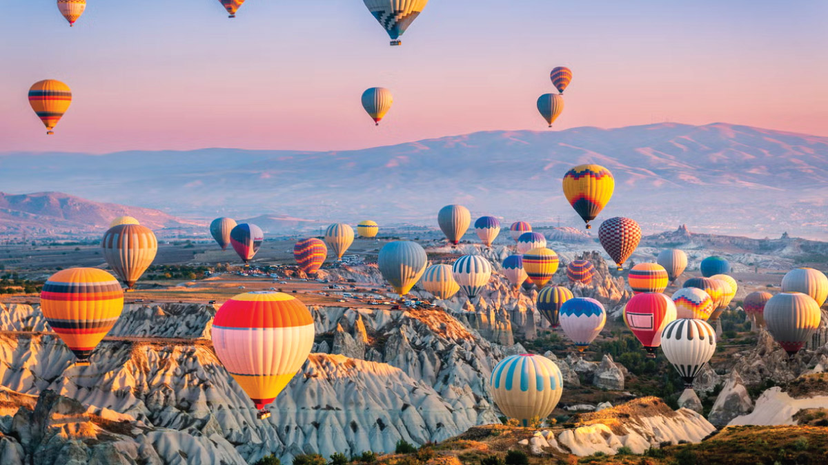 Hot air balloons floating over Cappadocia, Turkey, inspire self-flying pilots with their own aircraft to explore the breathtaking landscapes and cultural wonders of Eurasia, offering a unique perspective on a journey through ancient history and natural beauty.