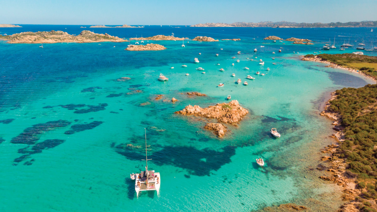 Scenic views of Sardinia, Italy, beckoning self-flying pilots with their own aircraft to embark on a journey through Eurasia's diverse landscapes, where azure waters, rugged coastlines, and historic charm await exploration from above.