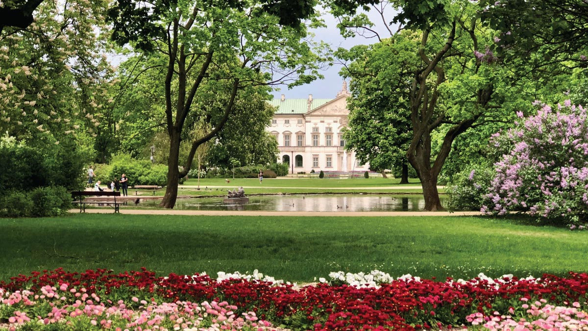 Krasiński Garden in Warsaw, Poland, beckoning self-flying pilots with their own aircraft to explore Europe's green oases and historical landmarks amidst tranquil surroundings.