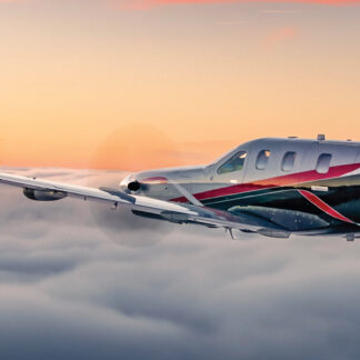 A stunning image of a TBM aircraft flying at sunset over picturesque European landscapes. Tailored for self-flying pilots