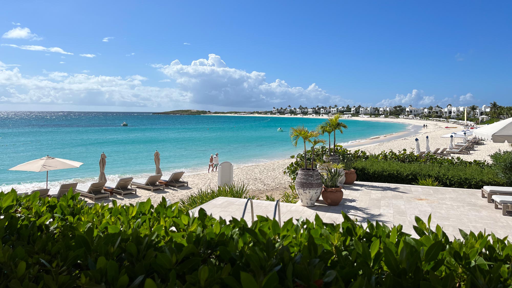 A captivating view of Belmond Cap Juluca in The Valley, Anguilla, featuring luxurious beachfront villas and turquoise waters stretching to the horizon. Tailored for self-flying pilots planning a caribbean adventure