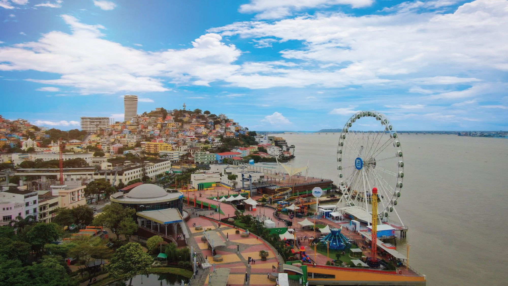 An expansive aerial vista showcasing the cityscape of Guayaquil, Ecuador, inviting self-flying pilots to embark on a journey to the Galapagos Islands.