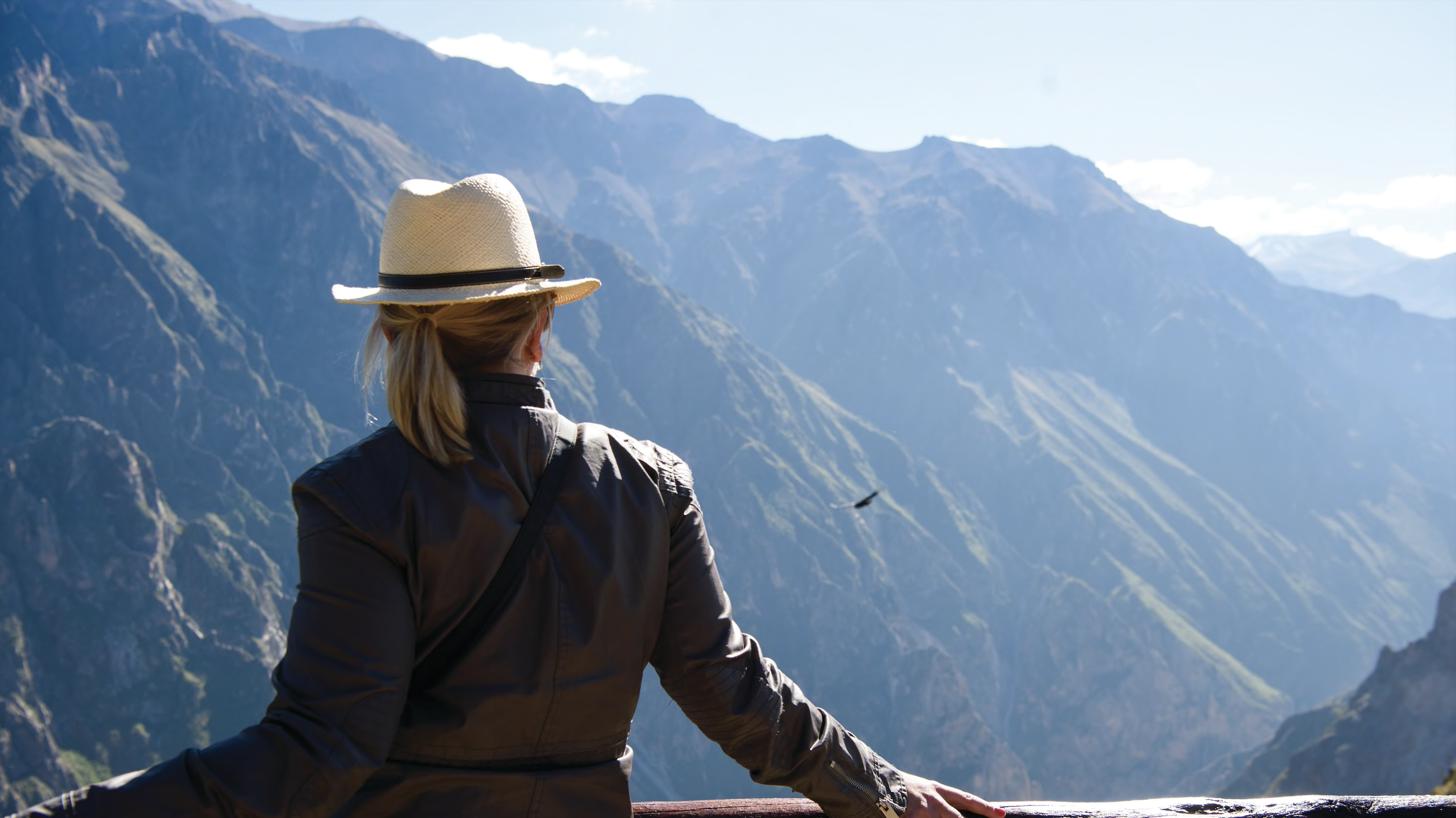 Woman bird-watching at Belmond Las Casitas in Colca Canyon, Peru