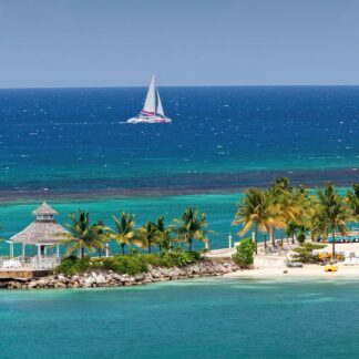 A captivating aerial view of Ocho Rios, Jamaica, with its pristine beaches and lush greenery, beckoning self-flying pilots to explore the enchanting landscapes of the Caribbean.