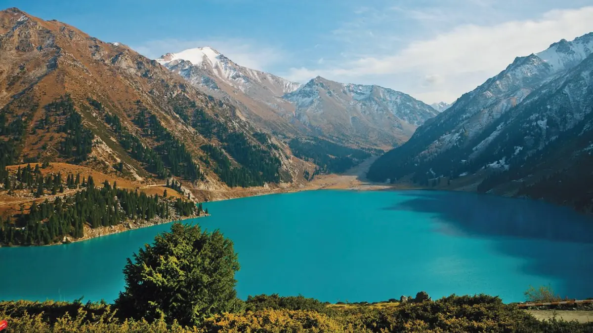 Issyk Lake in Kazakhstan, nestled against the backdrop of the Zailiyskiy Alatau Mountain range, inspires self-flying pilots with their own aircraft to set their sights on Europe, where adventure awaits amidst stunning natural beauty and cultural exploration.