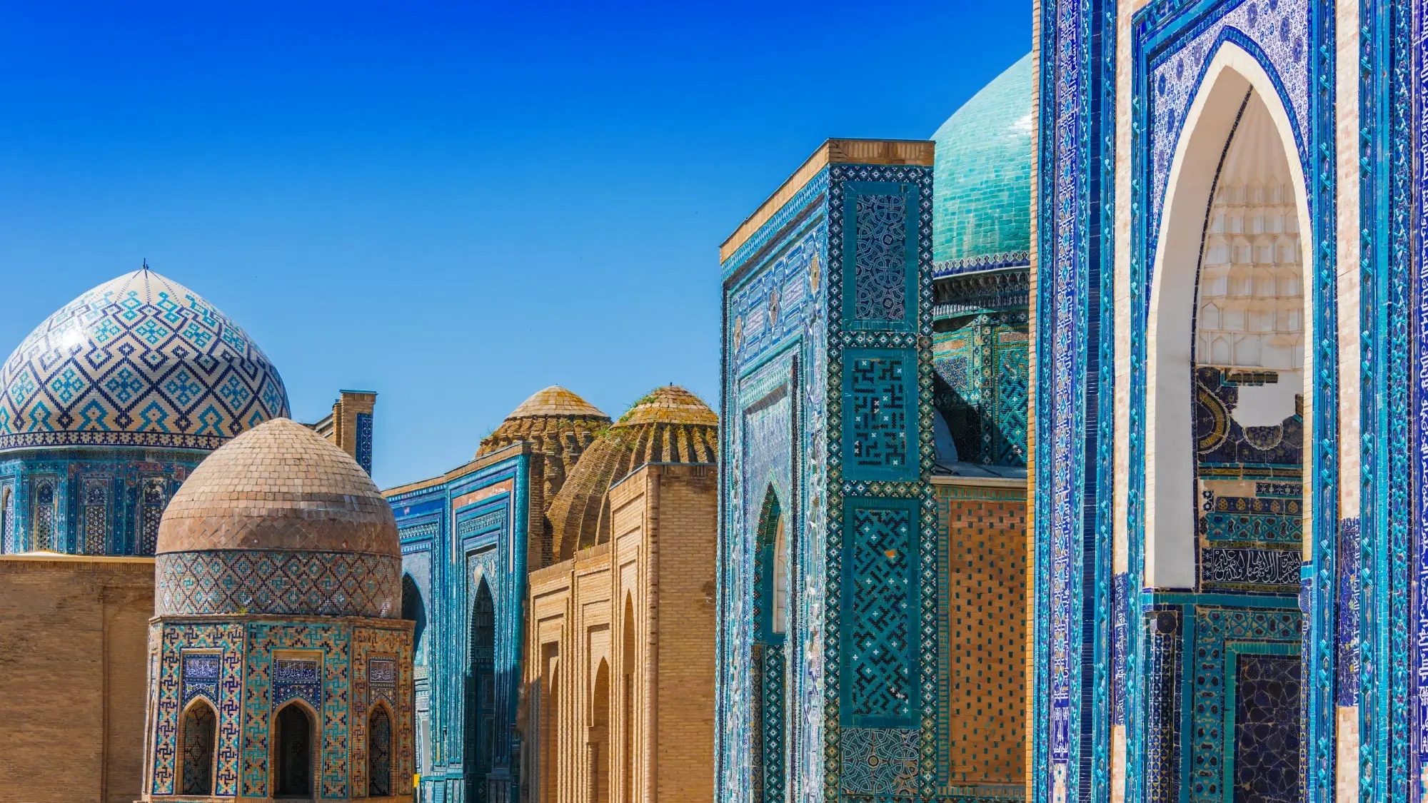 A stunning view of the historic city of Samarkand, Uzbekistan, showcasing its majestic architecture and intricate tilework. Samarkand is a highlight of a journey to Australia, visiting 21 countries, perfect for travelers who fly and own their own airplanes.